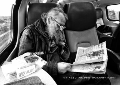 Old man and his newspaper.